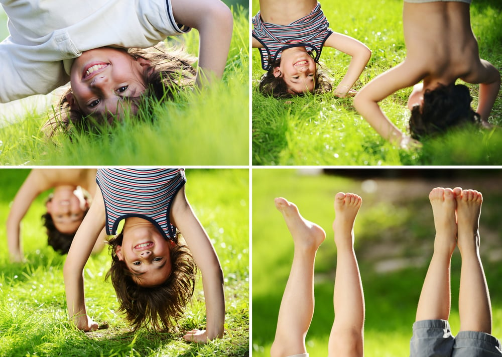 Kids playing upside down outdoors in summer park walking on hands, Allison Rish, Enriched Movement Pediatric Physical Therapy, Dublin, Ohio